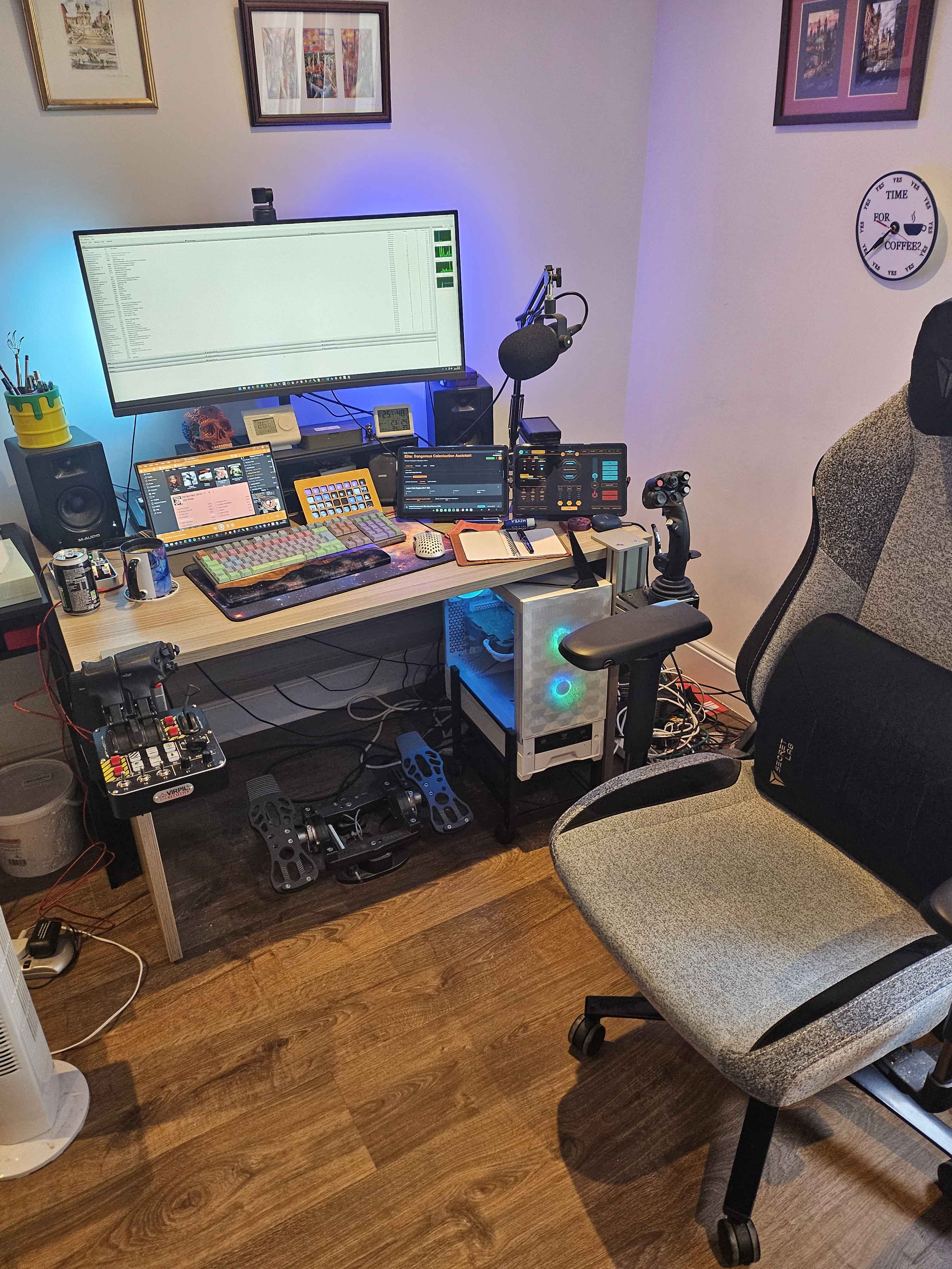 Command battlestation photo 1: desk setup with large monitor, laptops and control decks